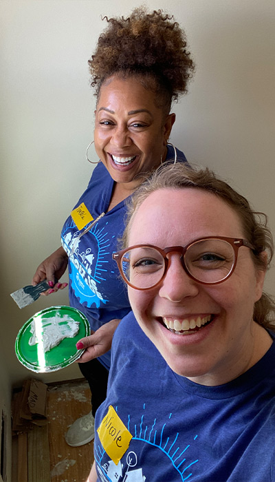 First Merchants Team Members painting a bedroom..