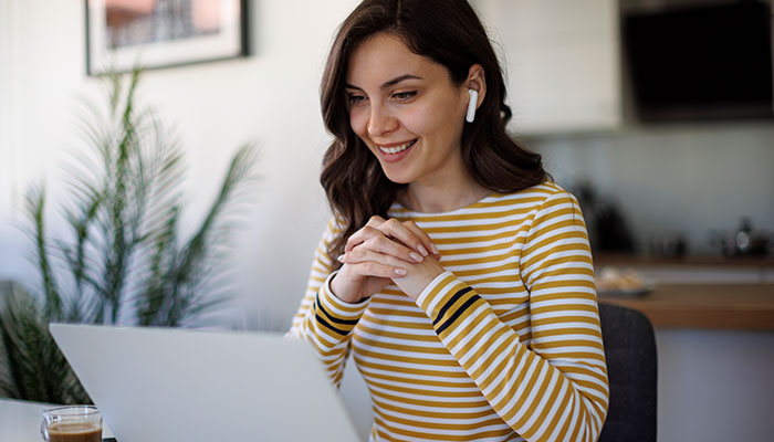 Q2-Commercial-Digital-Platforms-Videos700x400 Woman watch training videos at work.