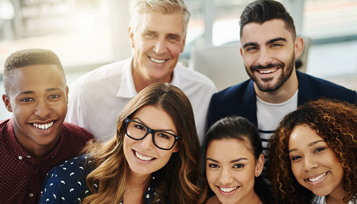 Group of diverse co-workers posing in an office atmosphere