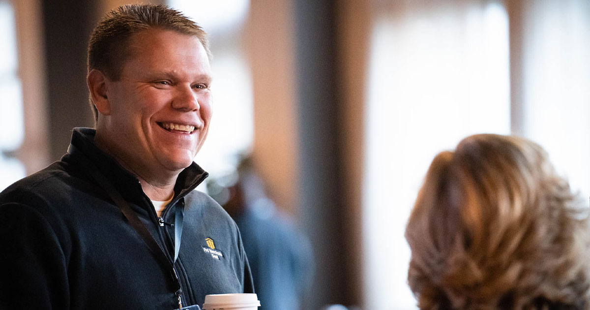 Leadership talking during a company event.