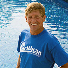 Curtis Joiner standing in front of a pool