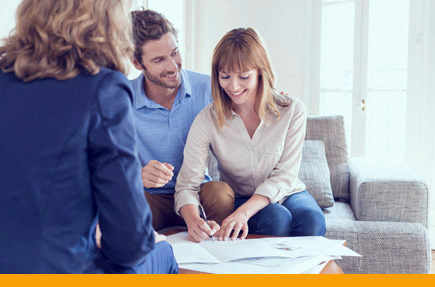 equity-loans Picture of couple signing documents