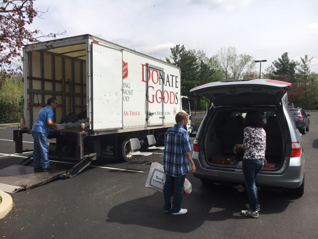 Picture of people unloading items to be recycled