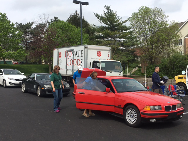 Picture of people unloading items to be recycled